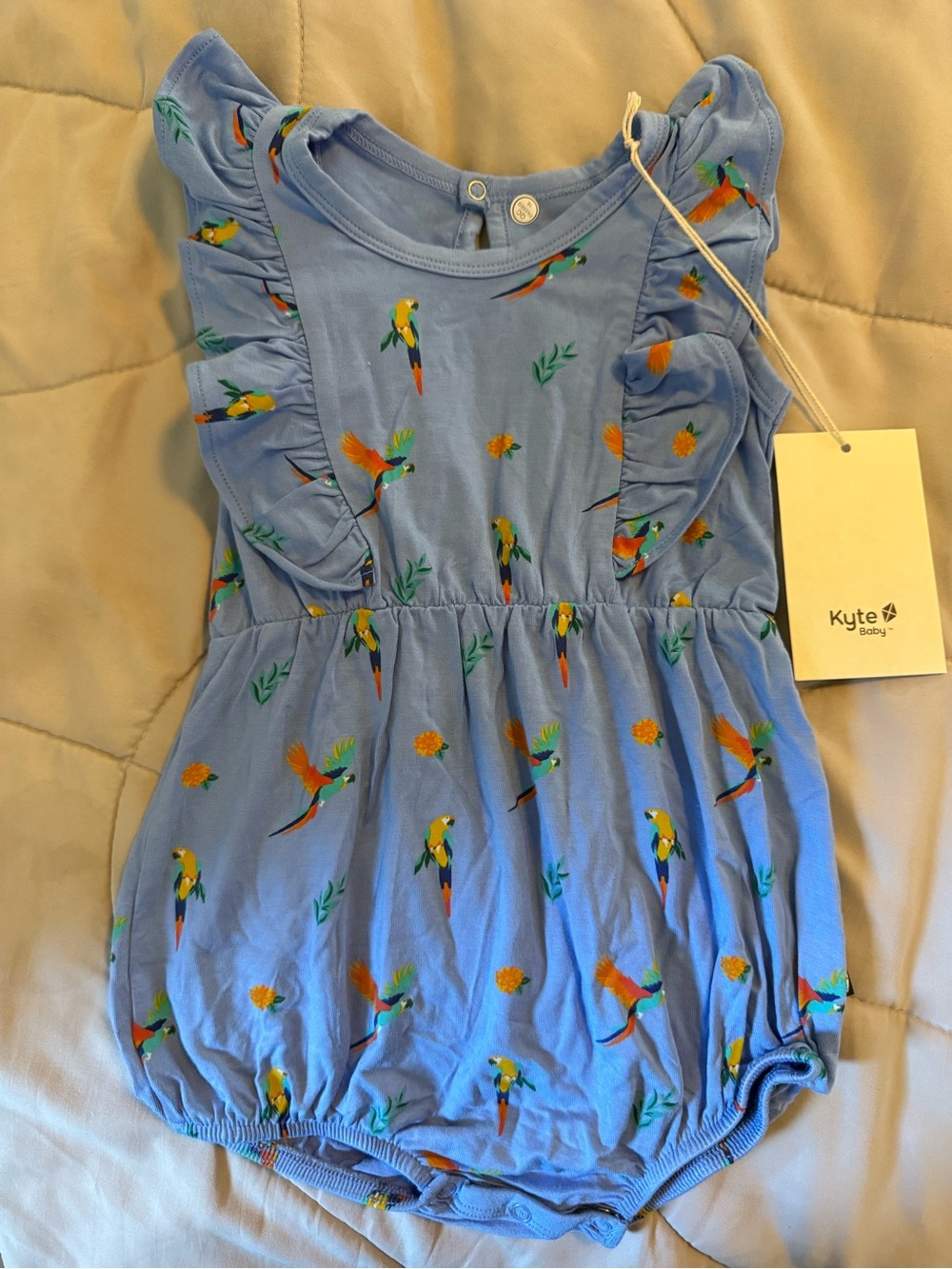 Kyte BABY Light Blue Parrot Print Ruffle Romper